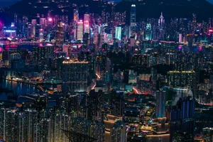A view of a city at night with a mountain in the background jigsaw puzzle