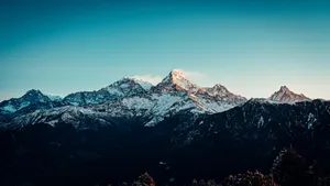 snow covered mountain under blue sky during daytime jigsaw puzzle