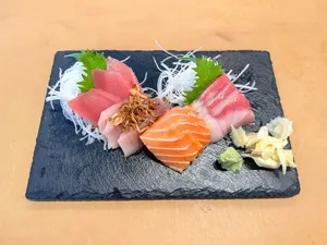 a plate of sushi on a wooden table jigsaw puzzle