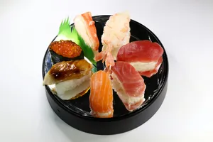 sliced meat with green leaf on black ceramic plate jigsaw puzzle