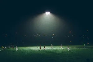 group of people playing soccer on soccer field jigsaw puzzle
