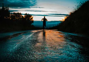 silhouette photo of a person running on road jigsaw puzzle