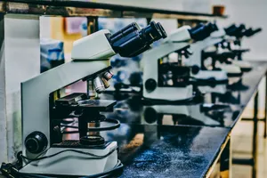 white microscope on top of black table jigsaw puzzle
