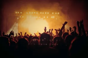 band performing on stage in front of people jigsaw puzzle
