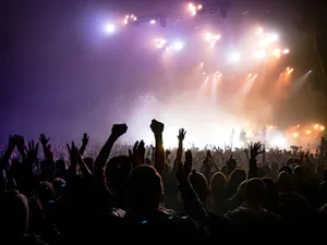 crowd facing lighted stage jigsaw puzzle