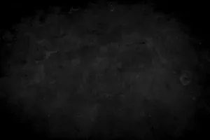 a black and white photo of a dark background jigsaw puzzle