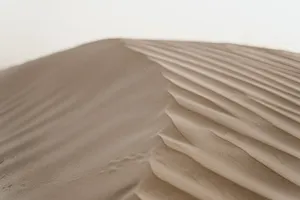 A beautiful close-up of sand dunes in a desert landscape, showcasing natural patterns. jigsaw puzzle