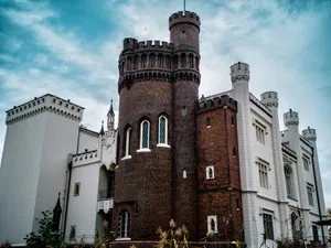 Stunning exterior of Kórnik Castle showcasing gothic revival architecture under blue skies. jigsaw puzzle