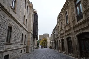 Capture of a cobblestone street in Baku's Old City, showcasing traditional stone architecture and the Maiden Tower. jigsaw puzzle
