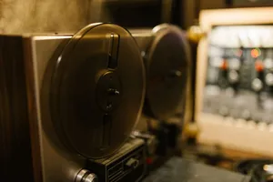 Close-up of a vintage tape recorder in a professional recording studio setting. jigsaw puzzle