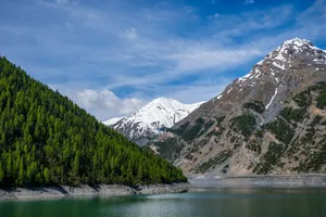 A mountain range with a lake in the foreground jigsaw puzzle