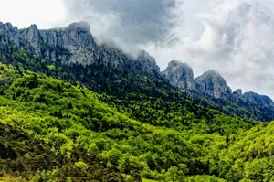 green and gray mountain under white clouds jigsaw puzzle