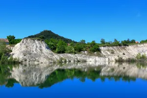A large body of water with a mountain in the background jigsaw puzzle