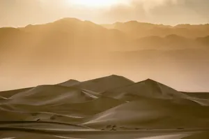 the sun is shining over the mountains in the desert jigsaw puzzle