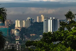 City skyline with modern buildings nestled among trees. jigsaw puzzle