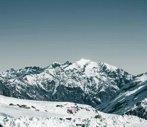snow covered mountain under blue sky during daytime jigsaw puzzle