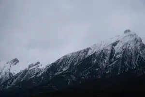 a mountain covered in snow on a cloudy day jigsaw puzzle