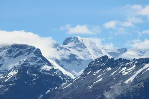 snow covered mountain under white clouds and blue sky during daytime jigsaw puzzle