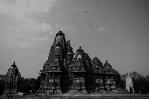 grayscale photo of building near body of water jigsaw puzzle