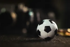 white and black soccer ball on black sand jigsaw puzzle