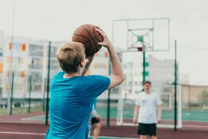 man in blue t-shirt holding basketball jigsaw puzzle