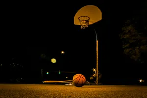 basketball hoop with lights turned on during night time jigsaw puzzle