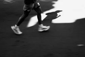 Runner's legs in motion with a long shadow. jigsaw puzzle