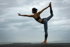woman in black sports bra and blue leggings doing yoga during daytime jigsaw puzzle