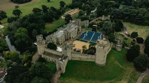 An aerial view of a castle with a tennis court jigsaw puzzle