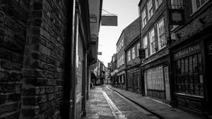Historic narrow street with old buildings in black and white. jigsaw puzzle