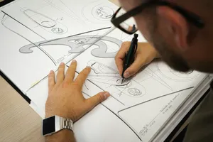 person writing on white paper jigsaw puzzle
