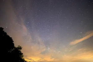 A breathtaking view of the star-filled night sky featuring the Milky Way and a meteor streak. jigsaw puzzle