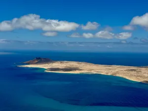 Stunning aerial shot showcasing the coastline of Lanzarote, Canary Islands under a clear blue sky. jigsaw puzzle