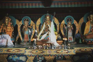 Colorful Tibetan Buddhist shrine featuring ornate statues and offerings. jigsaw puzzle