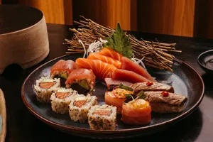 Delicious sushi platter featuring fresh salmon, tuna, and sushi rolls presented beautifully. jigsaw puzzle