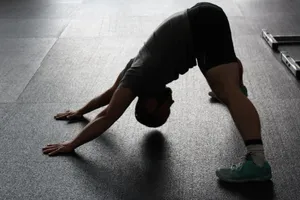 Silhouette of a man stretching indoors, showcasing fitness and flexibility. jigsaw puzzle