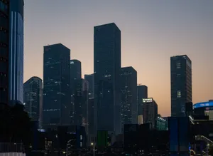 Silhouetted skyscrapers of a modern city against a twilight sky. jigsaw puzzle