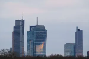 Modern skyscrapers dominate the Warsaw skyline. Twilight view offers a serene cityscape. jigsaw puzzle
