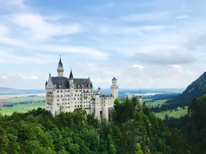 A stunning view of Neuschwanstein Castle in Schwangau, captured under a clear sky. jigsaw puzzle