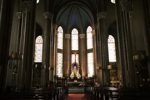 Inside view of St. Anthony of Padua Church showcasing its architecture, stained glass, and altar. jigsaw puzzle
