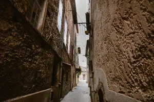 Charming narrow cobblestone street in Le Revest-les-Eaux, France, showcasing rustic architecture. jigsaw puzzle