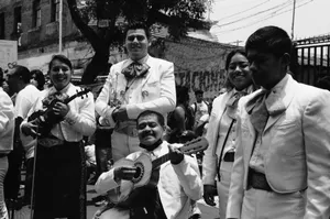 Grayscale photo of a mariachi band playing traditional music outdoors, highlighting cultural heritage. jigsaw puzzle