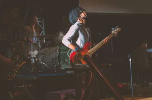 Dynamic live band performance featuring instruments and musicians on stage. jigsaw puzzle