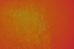 Close-up of a detailed vibrant orange textured wall with rough surface and paint effects. jigsaw puzzle
