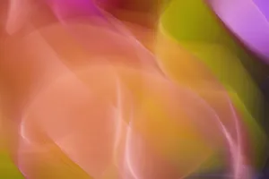 A dynamic and colorful abstract image showcasing vibrant light waves in pink, orange, and green hues, creating a surreal visual experience. jigsaw puzzle