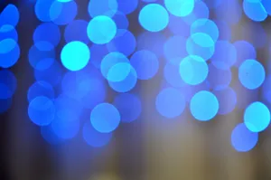 A mesmerizing abstract image with vibrant blue bokeh lights, creating a soothing pattern and mood. jigsaw puzzle