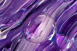 A close-up shot of vibrant purple abstract artwork featuring bubbles and textured acrylic paint. jigsaw puzzle