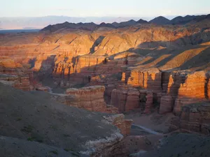 the sun is setting over the canyons in the desert jigsaw puzzle