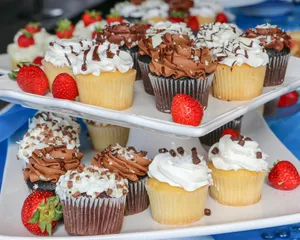 three trays of cupcakes with chocolate frosting and strawberries jigsaw puzzle