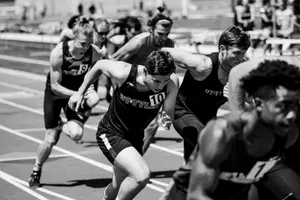 grayscale photo of people during marathon jigsaw puzzle
